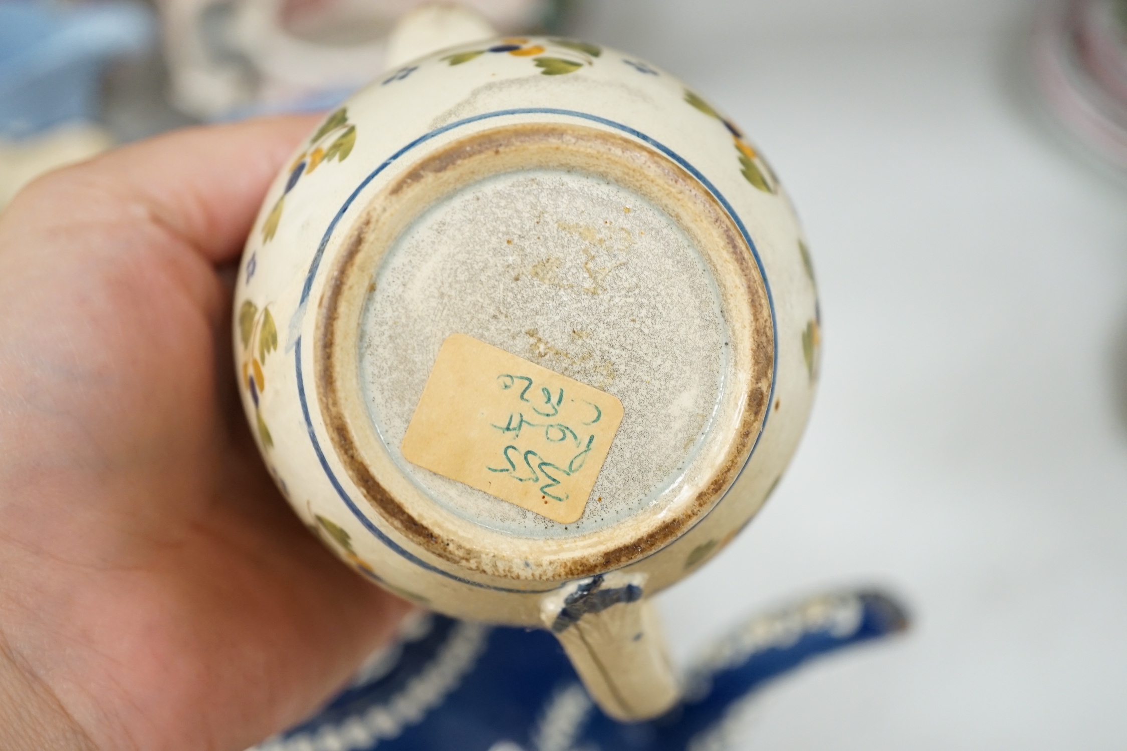 Two Pratt type jugs, an Enoch Wood flower pot, various 19th century pottery jugs, plates etc.